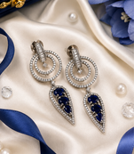 Rhodium finish sapphire halo drop earrings