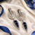 Rhodium finish sapphire halo drop earrings