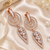 Rose gold finish white halo drop earrings