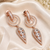Rose gold finish white halo drop earrings