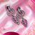 Black silver finish blush pink halo drop earrings