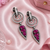 Black silver finish magenta halo drop earrings