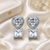 Rhodium finish heart halo crystal earrings