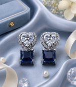Rhodium finish heart halo sapphire earrings