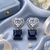Rhodium finish heart halo sapphire earrings