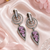 Black silver finish blush pink halo drop earrings
