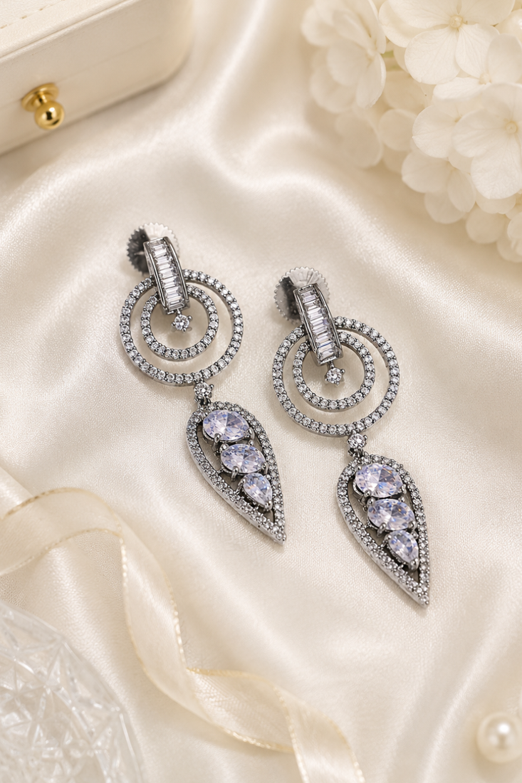 Black silver finish white halo drop earrings