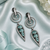 Black silver finish mint halo drop earrings