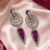 Black silver finish magenta halo drop earrings