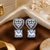 Rhodium finish heart halo crystal earrings