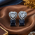 Rhodium finish heart halo sapphire earrings
