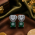 Rhodium finish heart halo emerald earrings