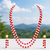 Double strand pearl and red coral bead necklace set with earrings