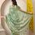 green floral printed cotton silk saree with unstitched blouse piece