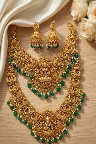 Temple jewelry set with goddess lakshmi pendant, peacock jhumkas & green beads - south indian bridal set