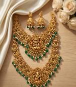 Temple jewelry set with goddess lakshmi pendant, peacock jhumkas & green beads - south indian bridal set