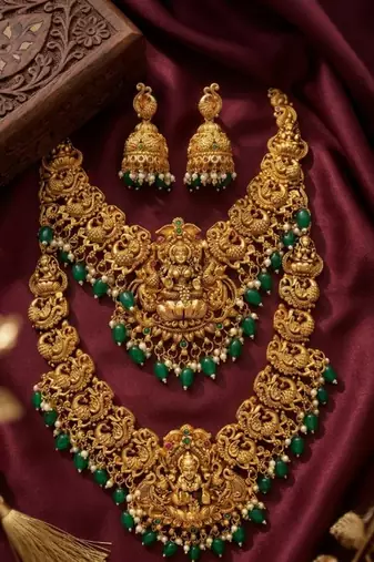 Temple jewelry set with goddess lakshmi pendant, peacock jhumkas & green beads - south indian bridal set