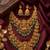 Temple jewelry set with goddess lakshmi pendant, peacock jhumkas & green beads - south indian bridal set
