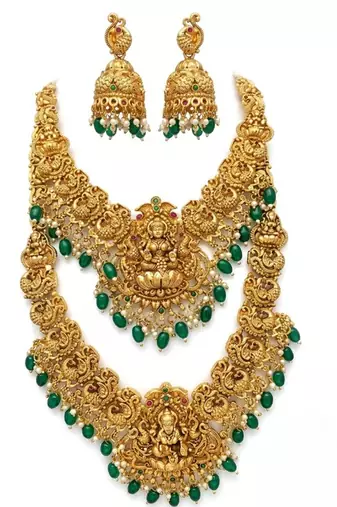 Temple jewelry set with goddess lakshmi pendant, peacock jhumkas & green beads - south indian bridal set