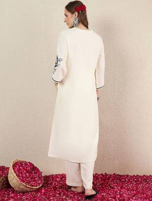 Women Solid Embroidered Kurta with Trousers 5