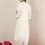 Women Solid Embroidered Kurta with Trousers