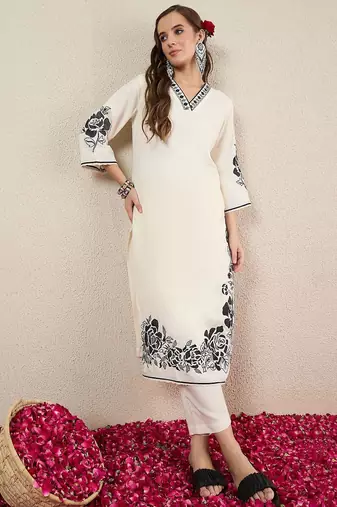 Women Solid Embroidered Kurta with Trousers