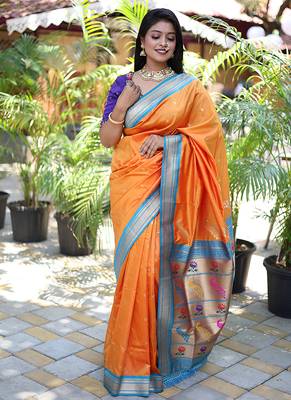 Orange paithani silk blend saree with contrast blue zari border 1