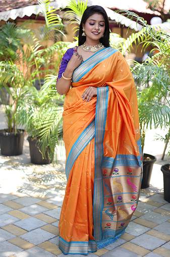 Orange paithani silk blend saree with contrast blue zari border