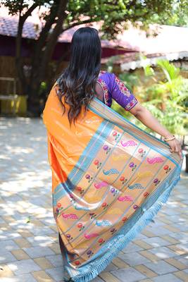 Orange paithani silk blend saree with contrast blue zari border 2