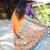 Orange paithani silk blend saree with contrast blue zari border