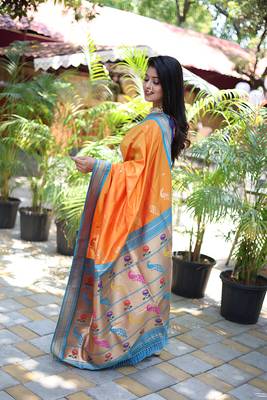 Orange paithani silk blend saree with contrast blue zari border 3