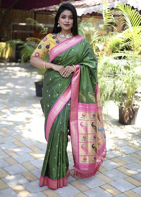 Mehendi green paithani silk blend saree with contrast magenta pink zari border 1