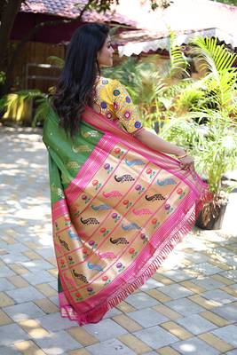Mehendi green paithani silk blend saree with contrast magenta pink zari border 2