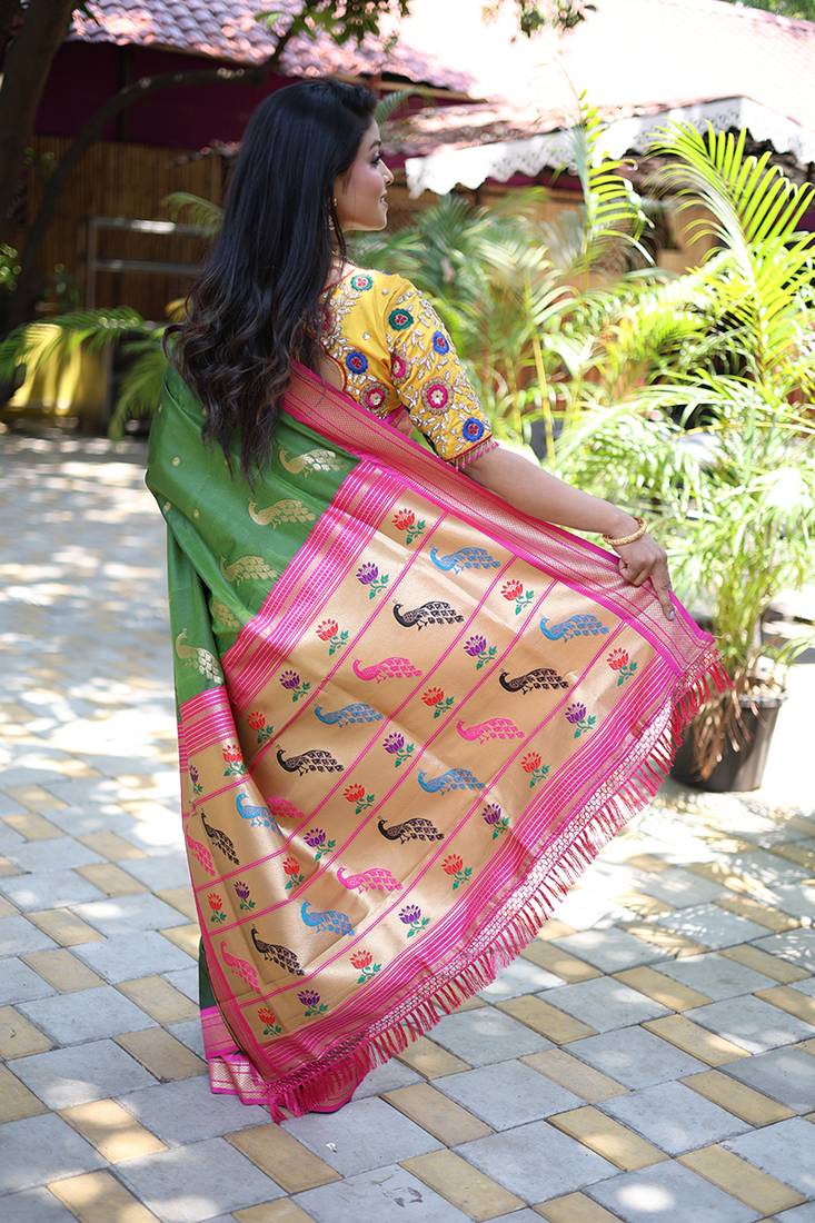 Mehendi green paithani silk blend saree with contrast magenta pink zari border
