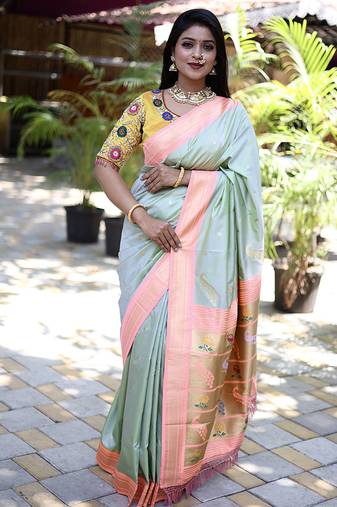 Mint green paithani silk blend saree with contrast peach zari border