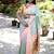 Mint green paithani silk blend saree with contrast peach zari border