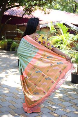 Mint green paithani silk blend saree with contrast peach zari border 2