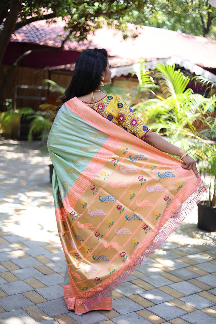 Mint green paithani silk blend saree with contrast peach zari border