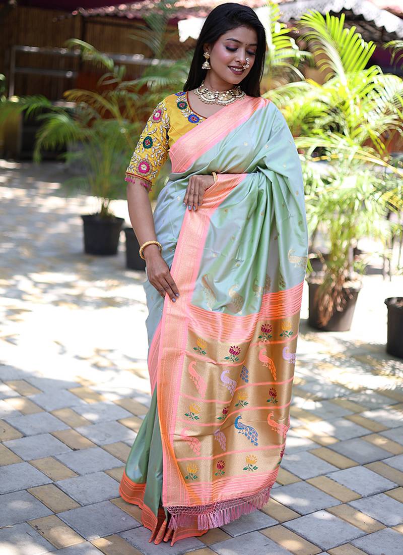 Mint green paithani silk blend saree with contrast peach zari border