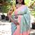 Mint green paithani silk blend saree with contrast peach zari border