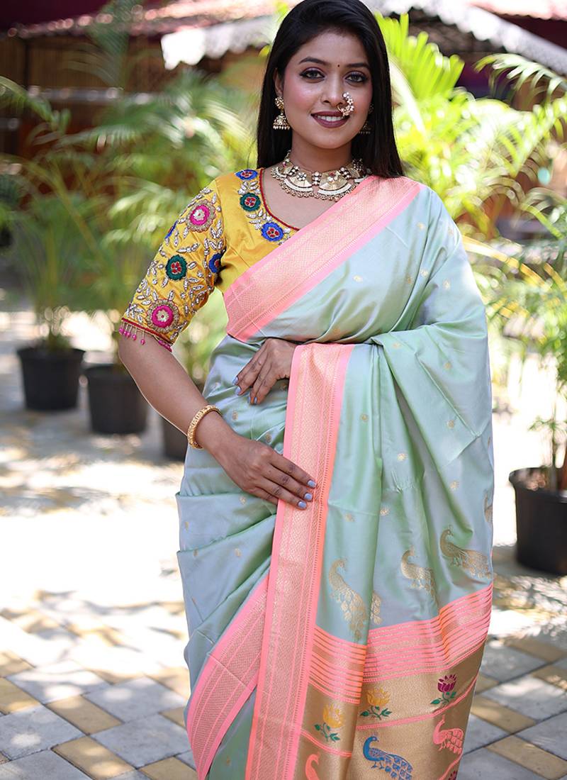 Mint green paithani silk blend saree with contrast peach zari border