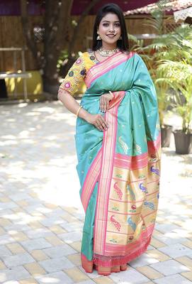Turquoise paithani silk blend saree with contrast pink zari border 1