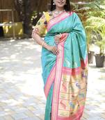 Turquoise paithani silk blend saree with contrast pink zari border