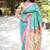 Turquoise paithani silk blend saree with contrast pink zari border