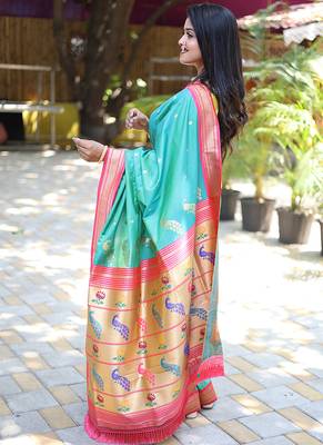 Turquoise paithani silk blend saree with contrast pink zari border 3
