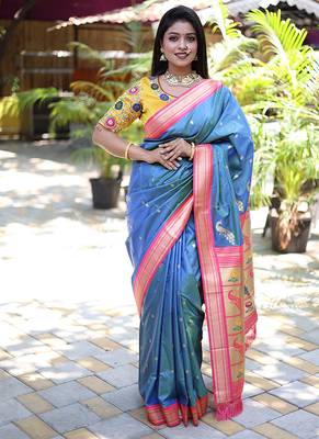 Light blue paithani silk blend saree with contrast pink zari border 1