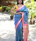 Light blue paithani silk blend saree with contrast pink zari border