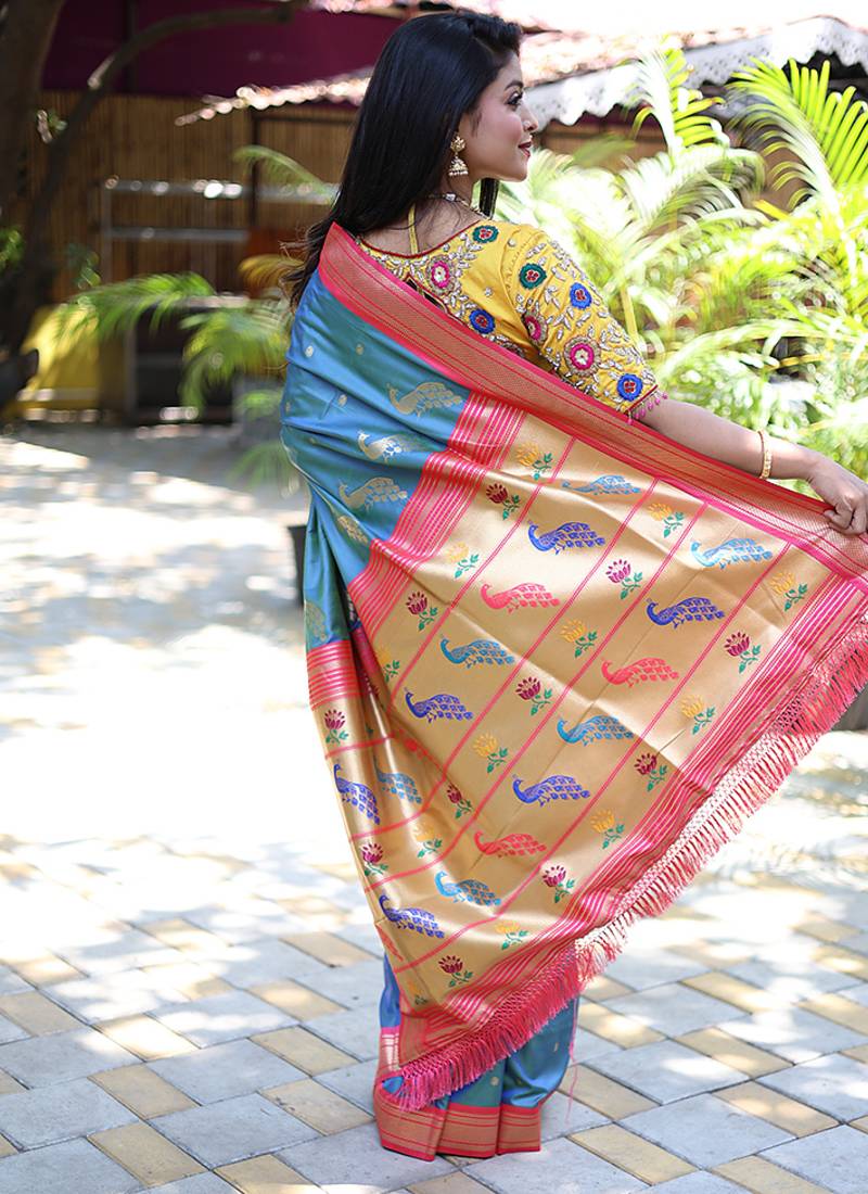 Light blue paithani silk blend saree with contrast pink zari border