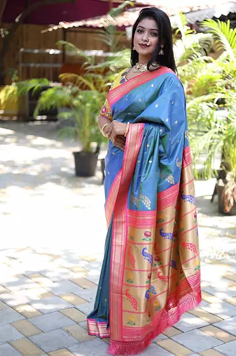Light blue paithani silk blend saree with contrast pink zari border