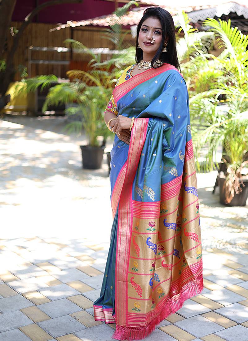 Light blue paithani silk blend saree with contrast pink zari border
